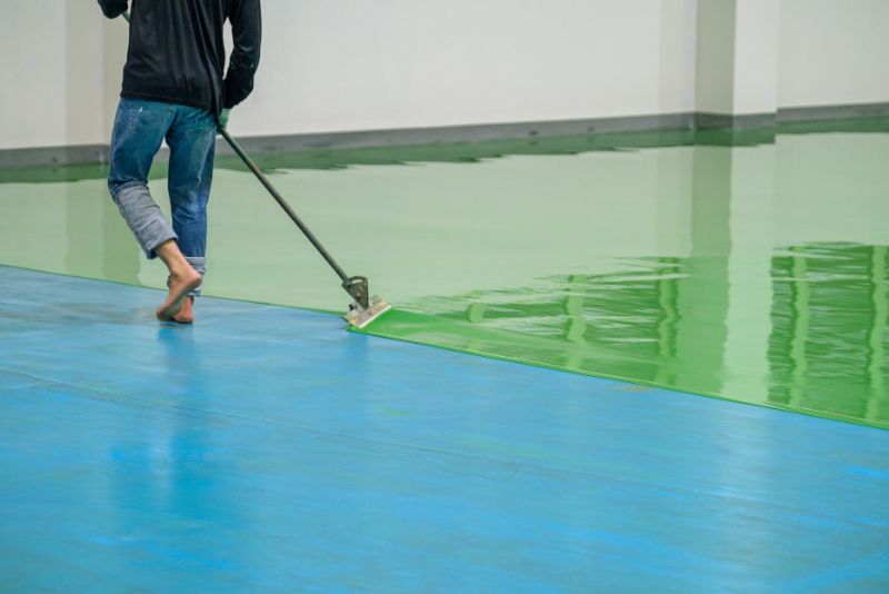 green epoxy flooring installation on floor